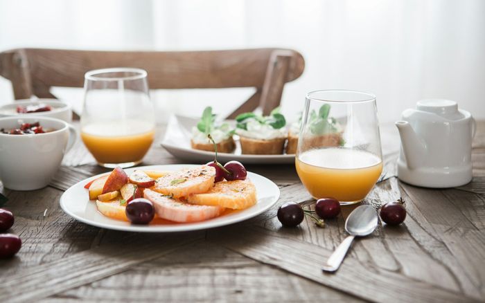 Breakfast table with fruit and juice
